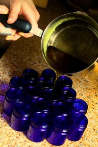 juliet Pouring the salve into jars